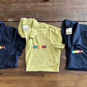M&M Super cute golf shirts by Nike.Never worn.     2 Navy blue and 1 lime green.